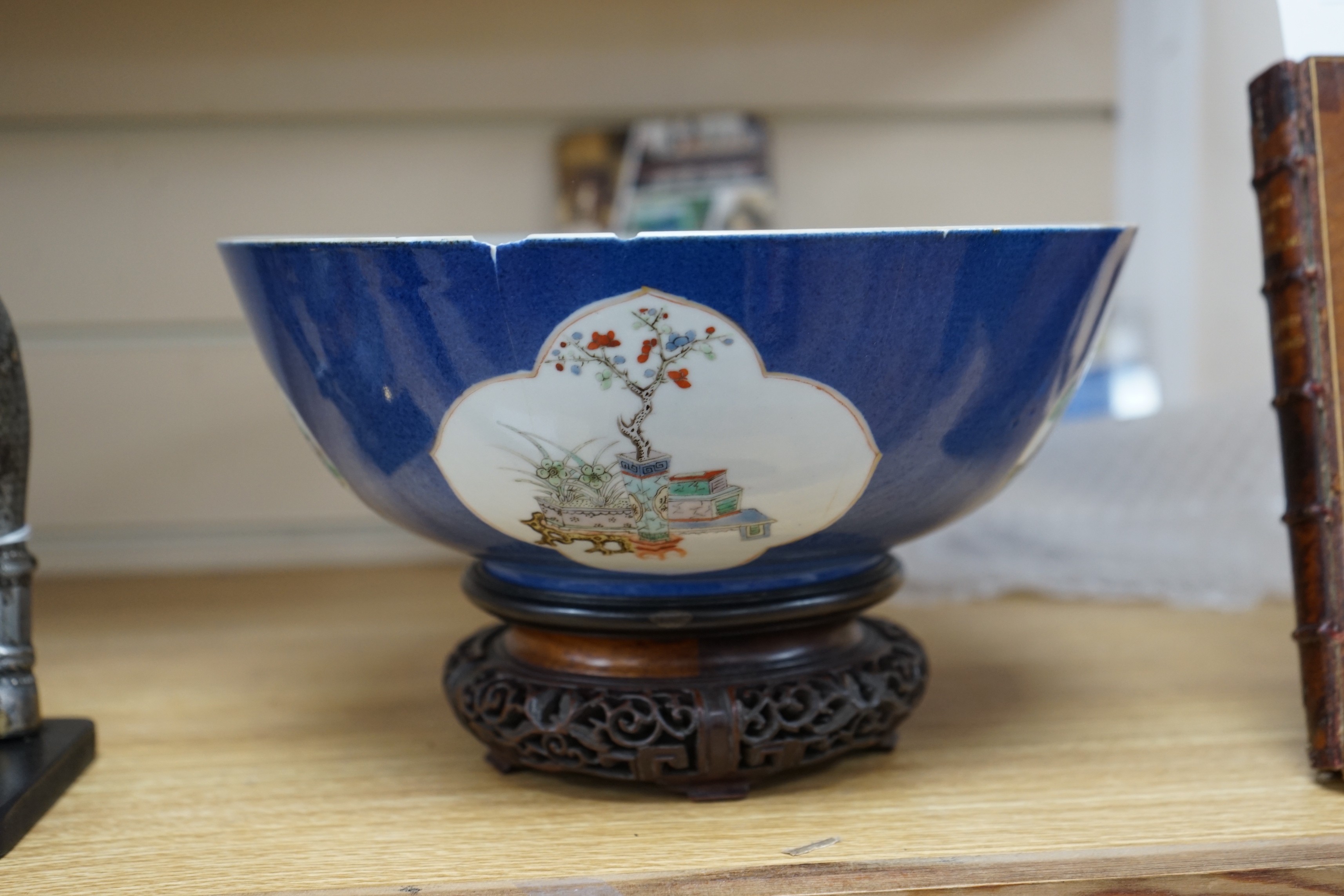 A 19th century Chinese famille verte powder blue bowl, 26cm diameter, wood stand
